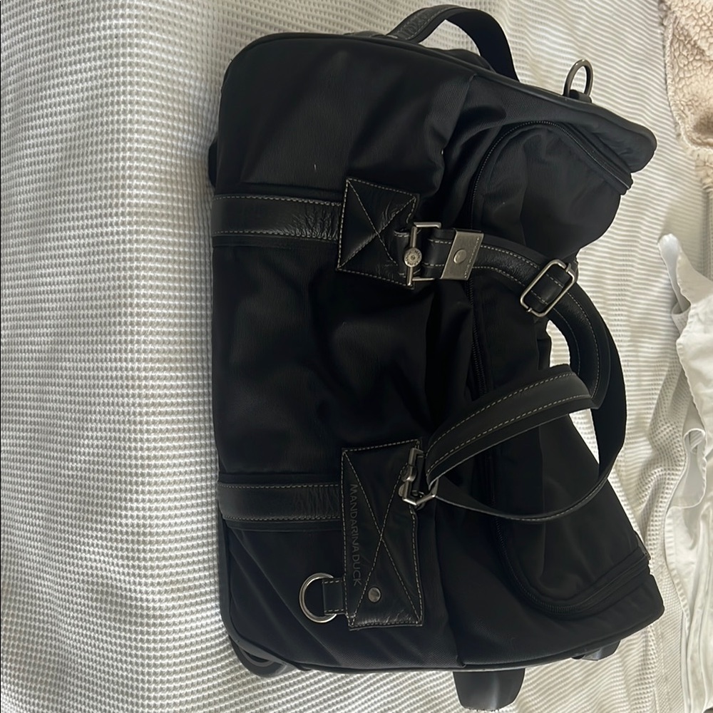 Black Travel Bag duffle bag with wheels. Perfect Carry on